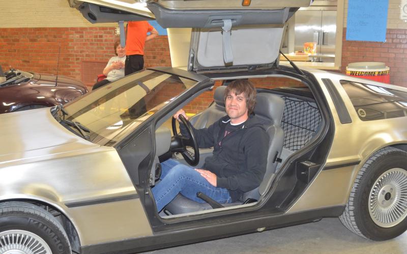 Concordia resident Will Metcalf displays his 1981 DeLorean, complete with the gull-wing doors, at the Heartland Auto Club Spring Extravaganza car show Saturday at the Concordia National Guard Armory